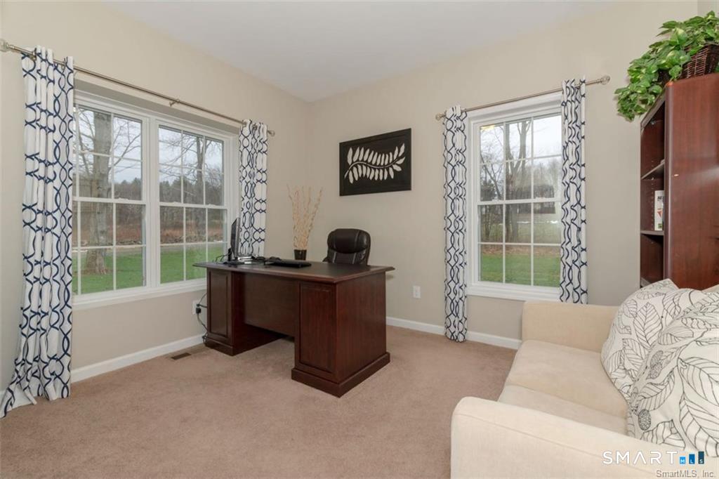 823 A Stone Road Windsor, CT 06095 - Photo 25 of 38 a living room with furniture and a window