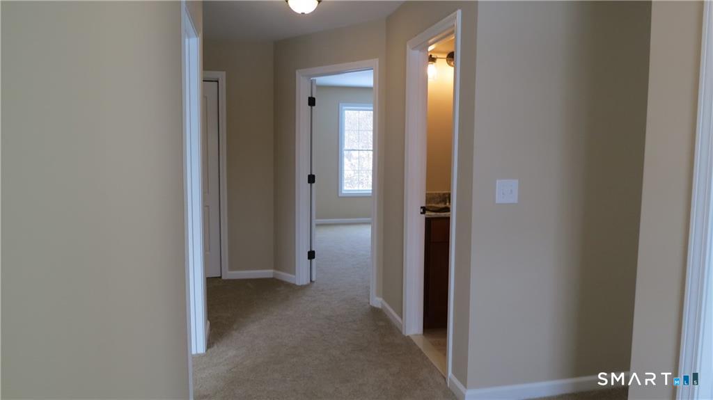 823 A Stone Road Windsor, CT 06095 - Photo 30 of 38 a view of a livingroom from a hallway