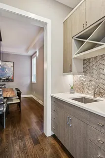 a kitchen with a sink and cabinets