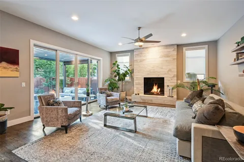 a living room with furniture fireplace and window