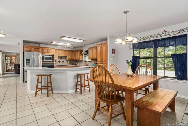 a dining room with furniture and window