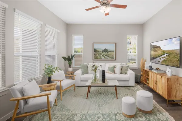 a living room with furniture and a flat screen tv