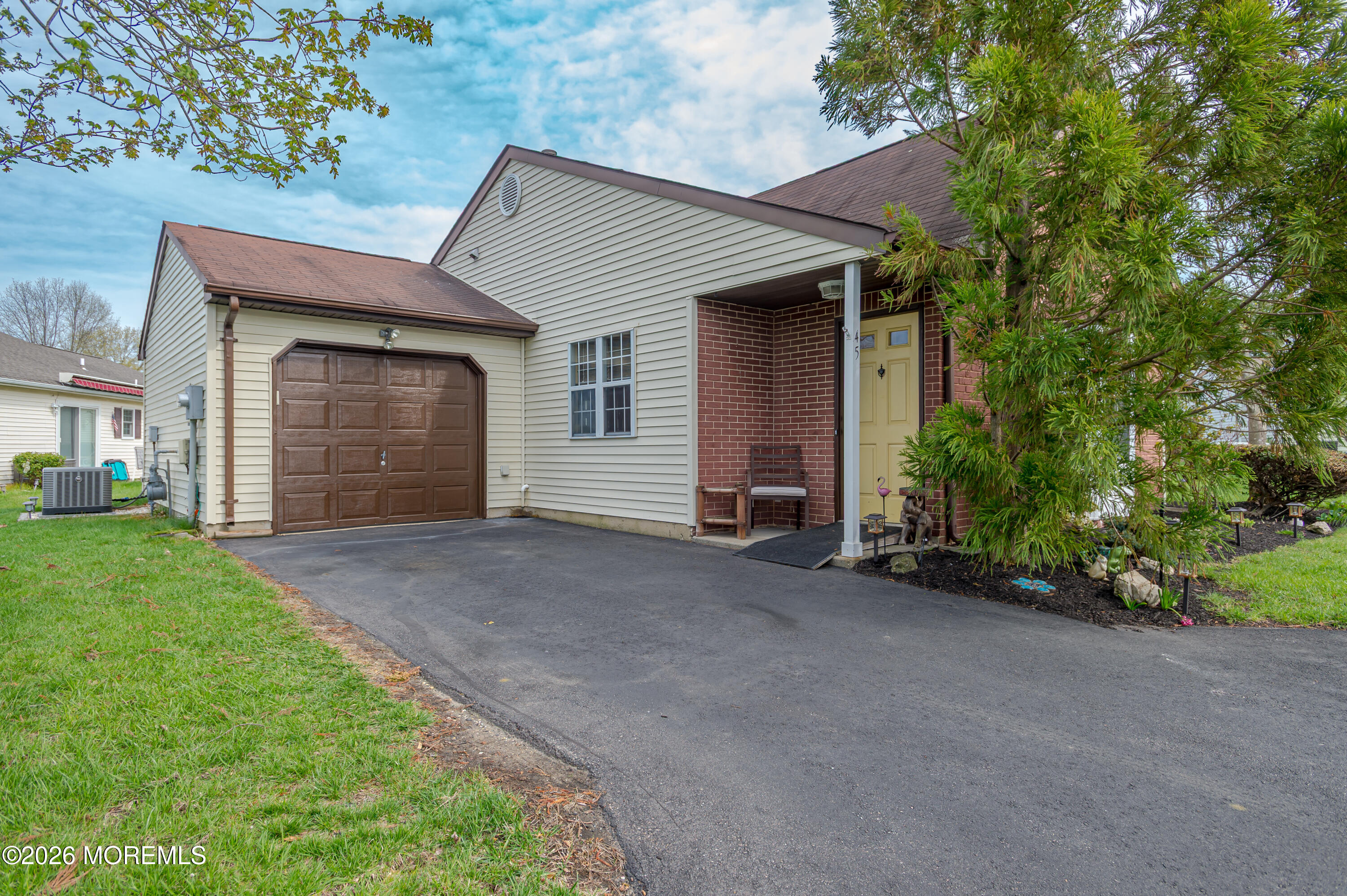 a view of a house with a yard and garage