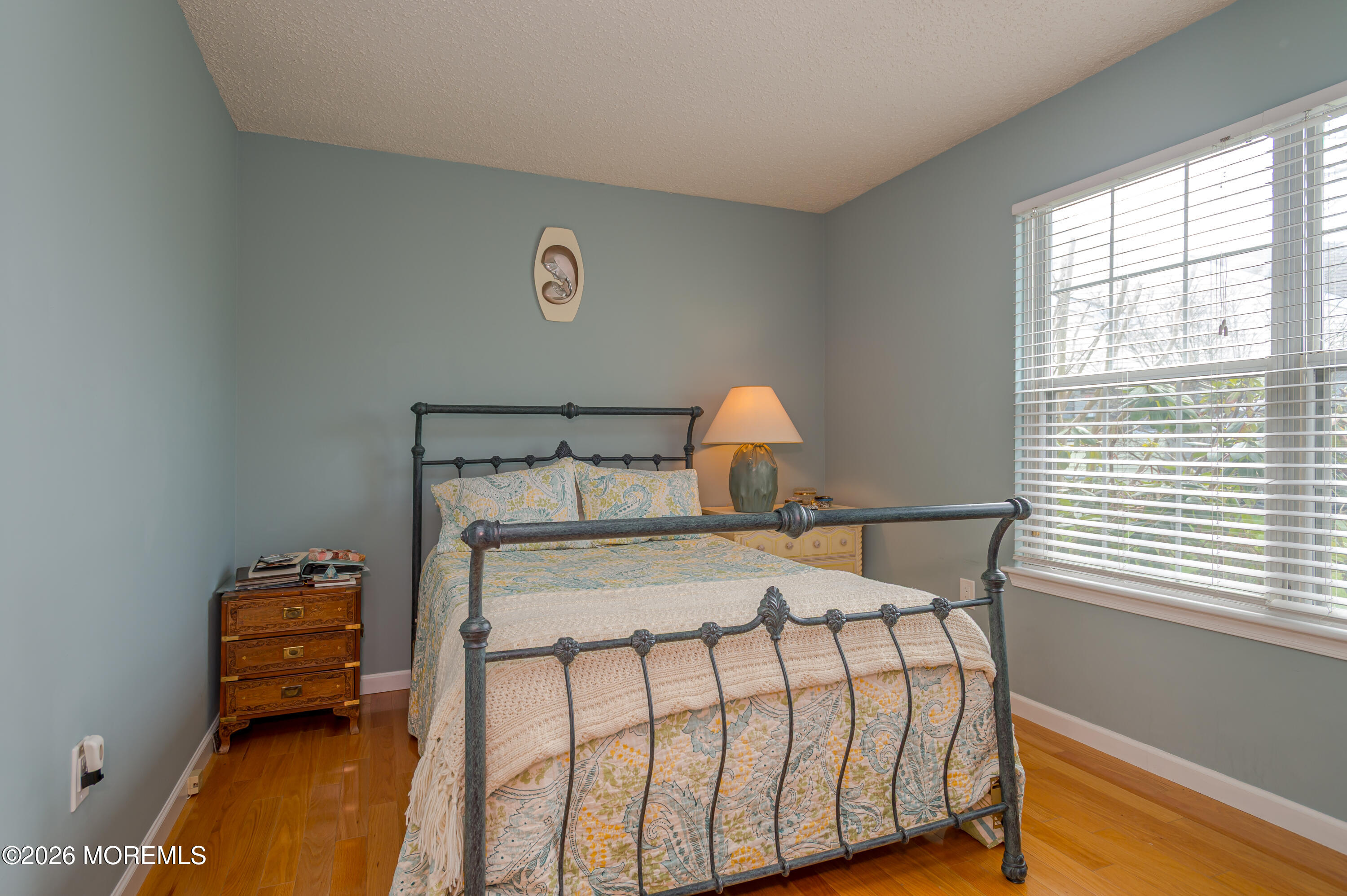 45 Datchet Close Freehold, NJ 07728 - Photo 18 of 22 a bedroom with a bed and wooden floor