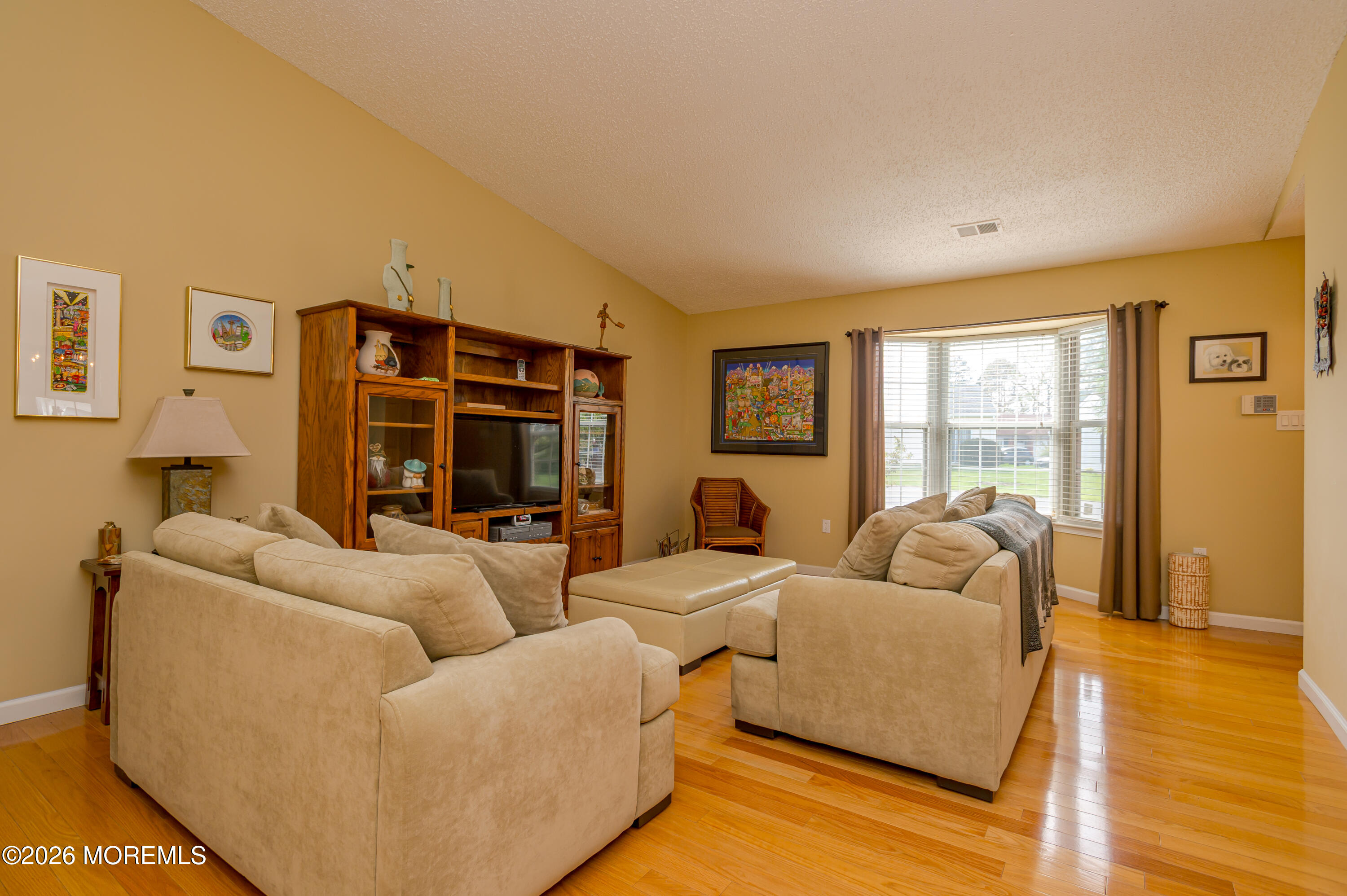 45 Datchet Close Freehold, NJ 07728 - Photo 4 of 22 a living room with furniture and a flat screen tv