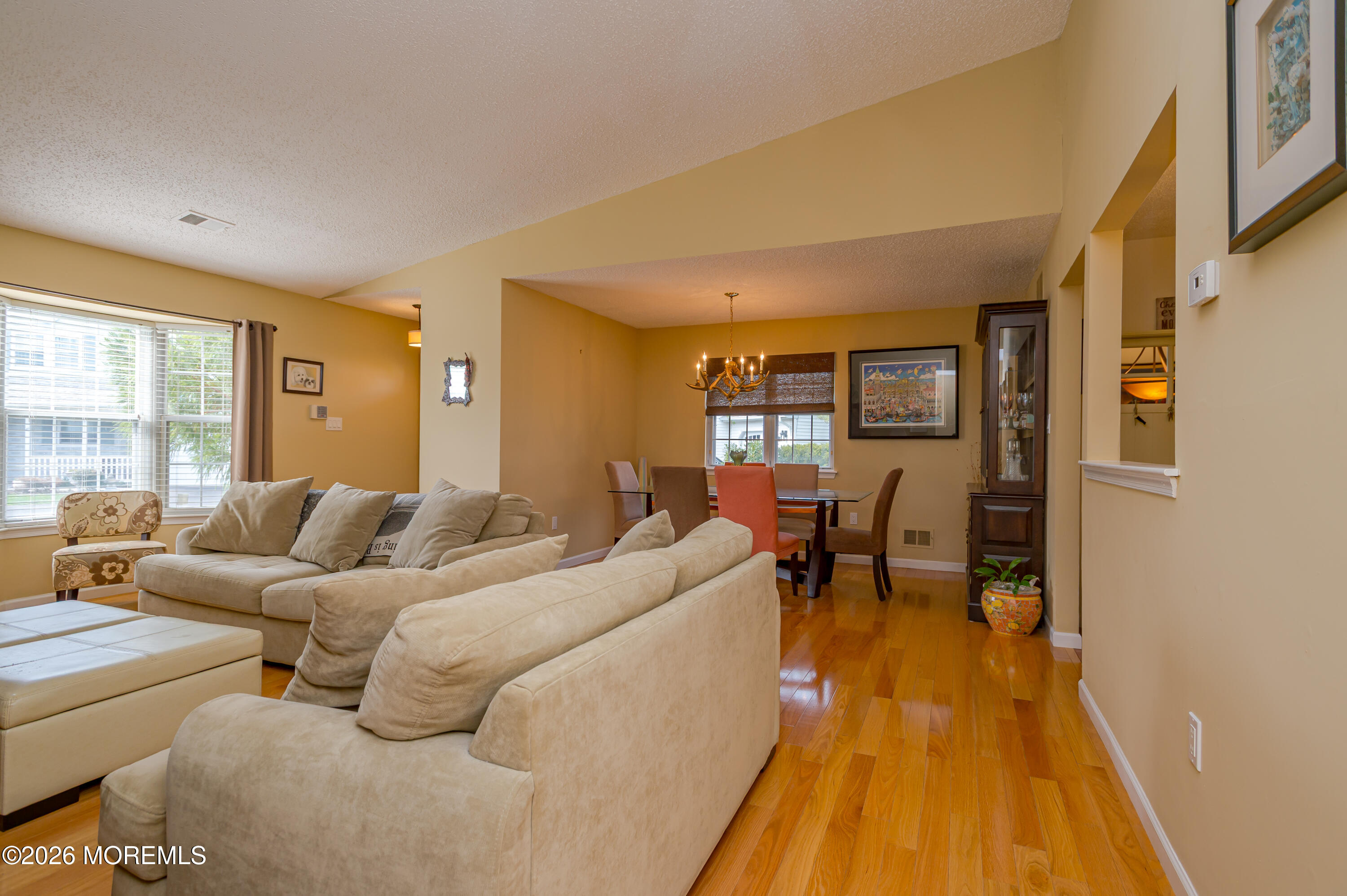 45 Datchet Close Freehold, NJ 07728 - Photo 6 of 22 a living room with furniture and a wooden floor