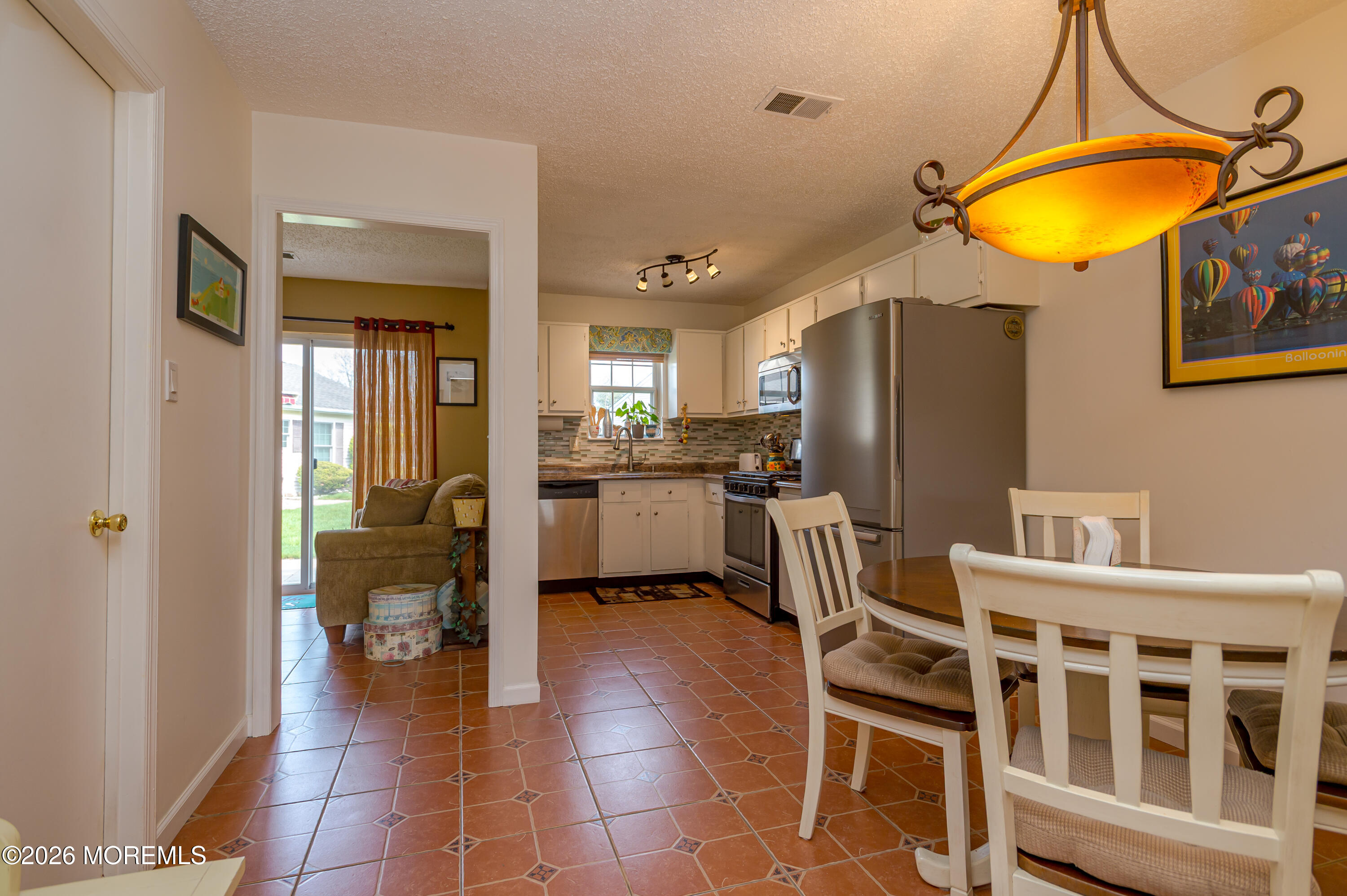 45 Datchet Close Freehold, NJ 07728 - Photo 10 of 22 a view of a kitchen and dining room