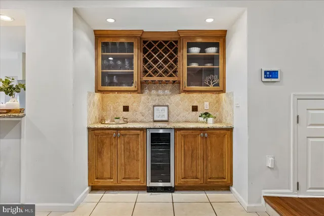 a kitchen with a sink and a refrigerator