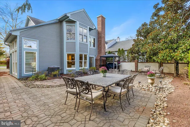 a view of a dinning table and chairs in the patio