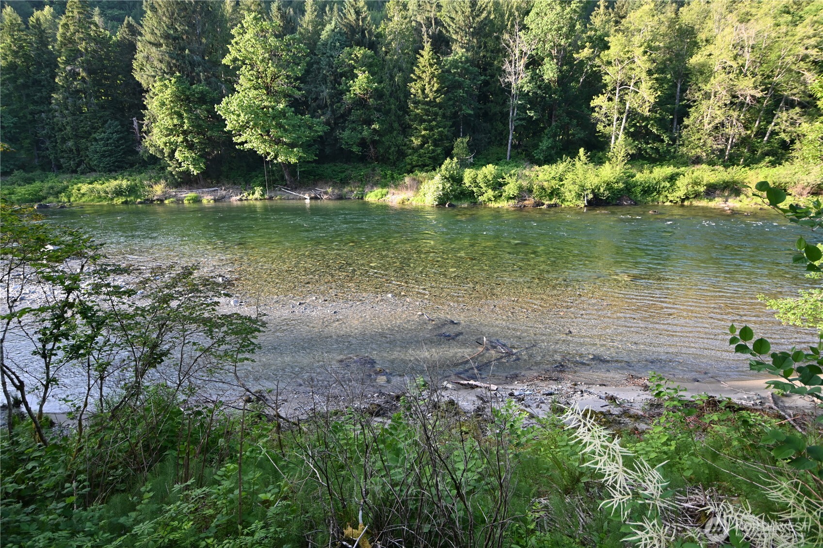 53009 South Riverside Road Gold Bar, WA 98251 - Photo 26 of 26 a view of a lake with a yard
