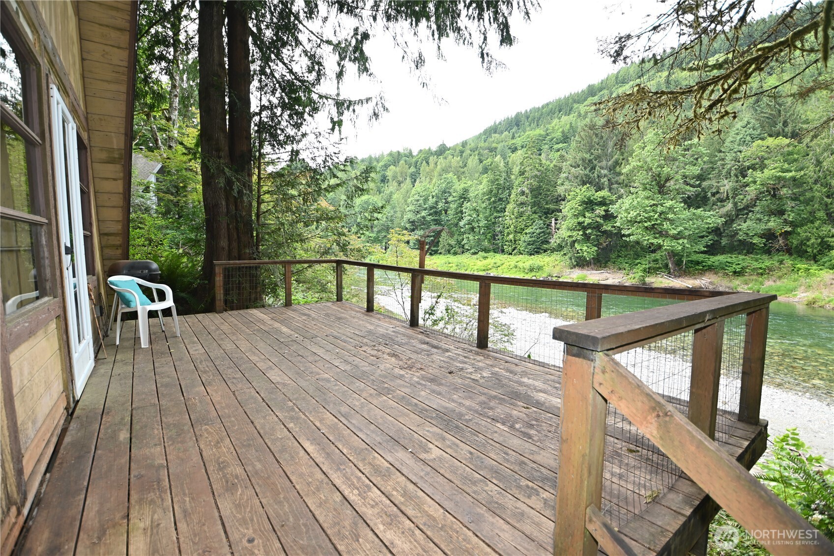 53009 South Riverside Road Gold Bar, WA 98251 - Photo 4 of 26 a view of balcony with wooden floor and seating space