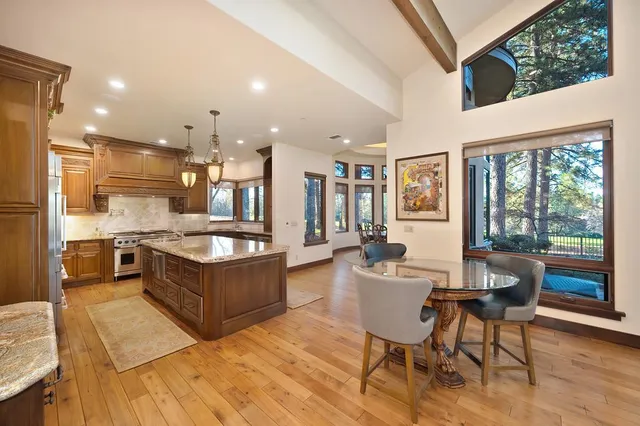 a kitchen with a stove a refrigerator and a sink