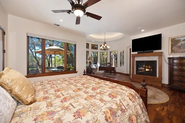 a bathroom with a granite countertop sink mirror vanity and toilet