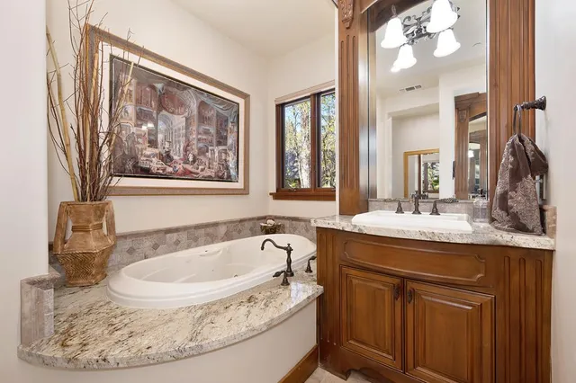 a living room with furniture and large windows