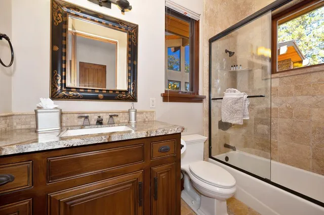 a view of a patio with table and chairs and potted plants