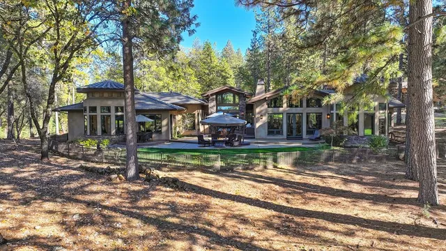 a view of a roof deck with couches and wooden floor