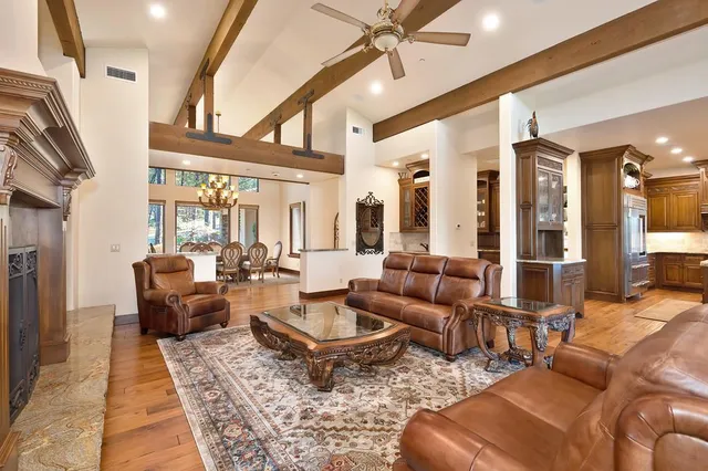 a dining room with furniture and wooden floor