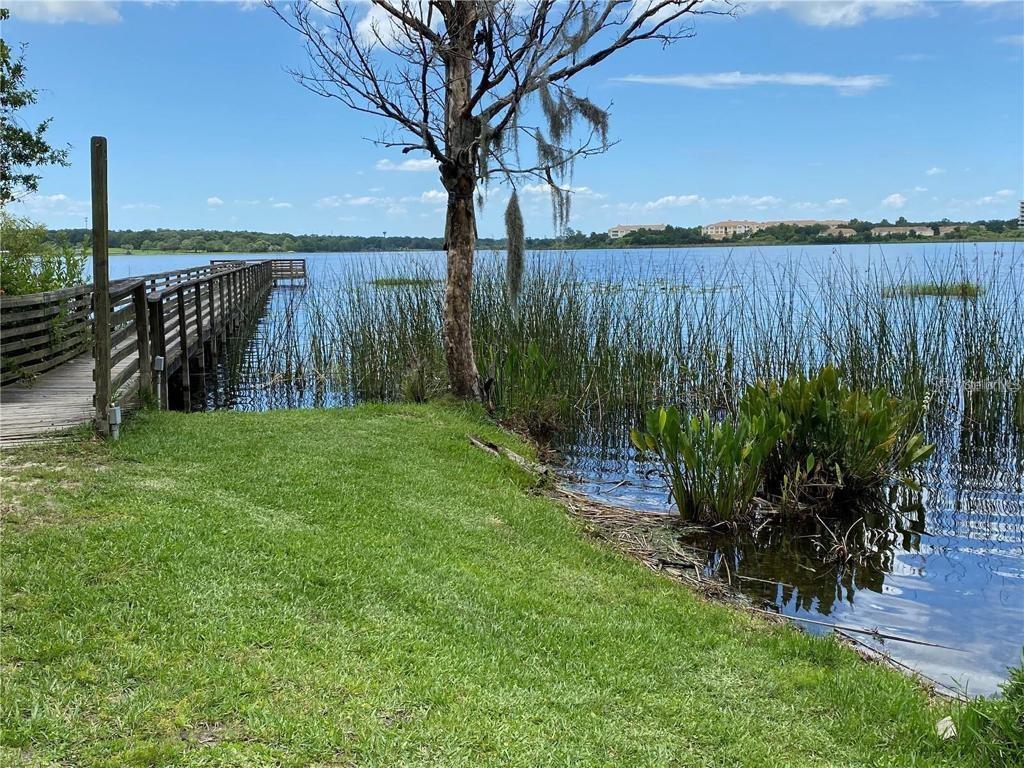 4332 South Kirkman Road, Unit 1012 Orlando, FL 32811 - Photo 20 of 20 a view of a garden with lake