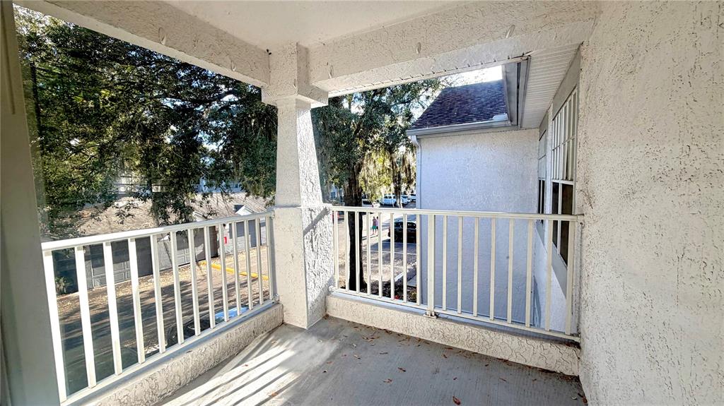 4332 South Kirkman Road, Unit 1012 Orlando, FL 32811 - Photo 7 of 20 a view of balcony with small garden