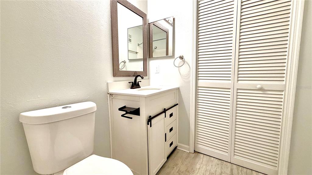 4332 South Kirkman Road, Unit 1012 Orlando, FL 32811 - Photo 10 of 20 a white toilet sitting next to a white sink