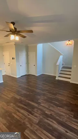 a bathroom with a granite countertop sink a toilet and shower