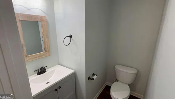 a bathroom with a shower and a sink