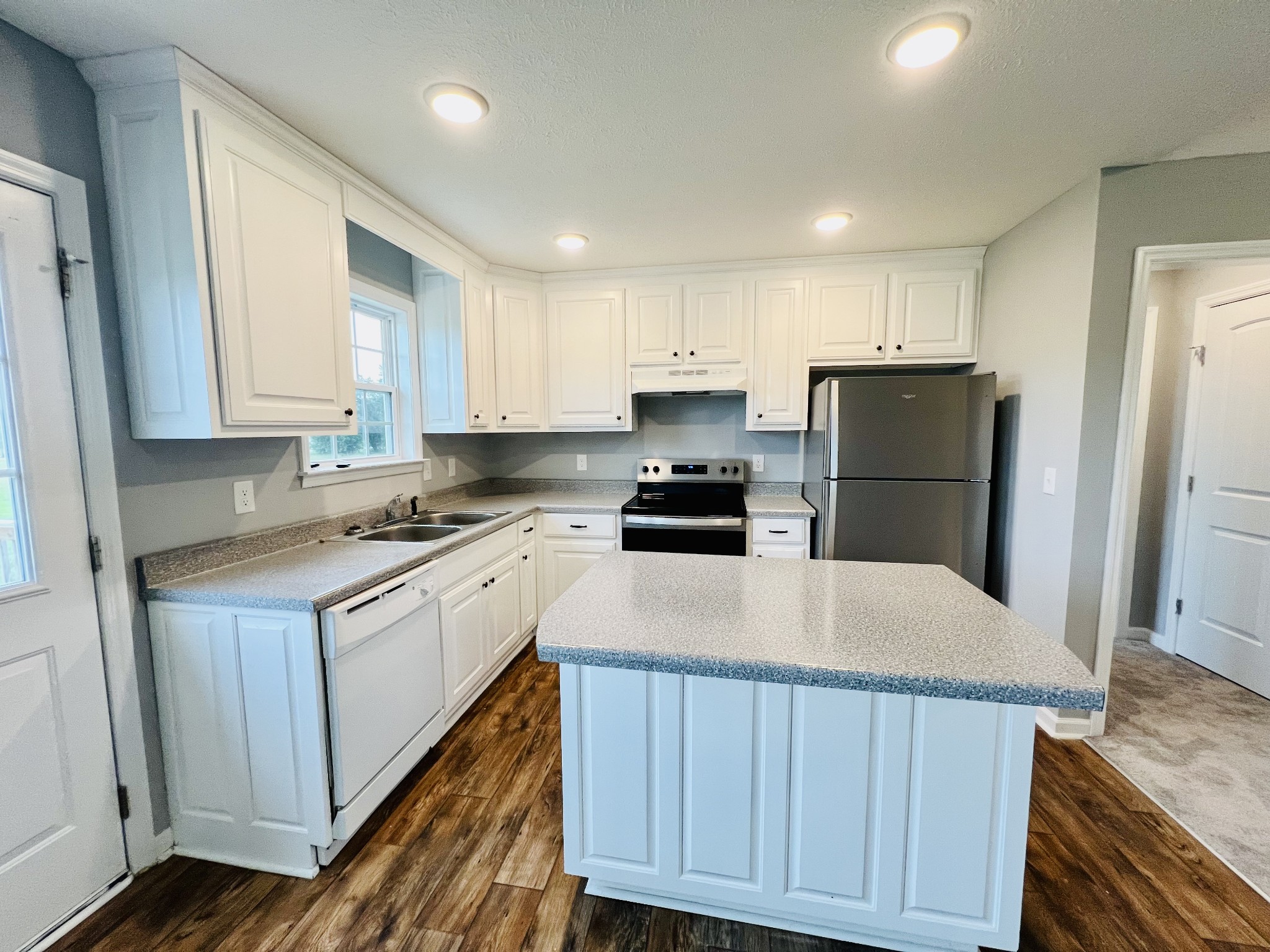 466 White Road Pulaski, TN 38478 - Photo 3 of 25 a kitchen with kitchen island a sink stove and refrigerator