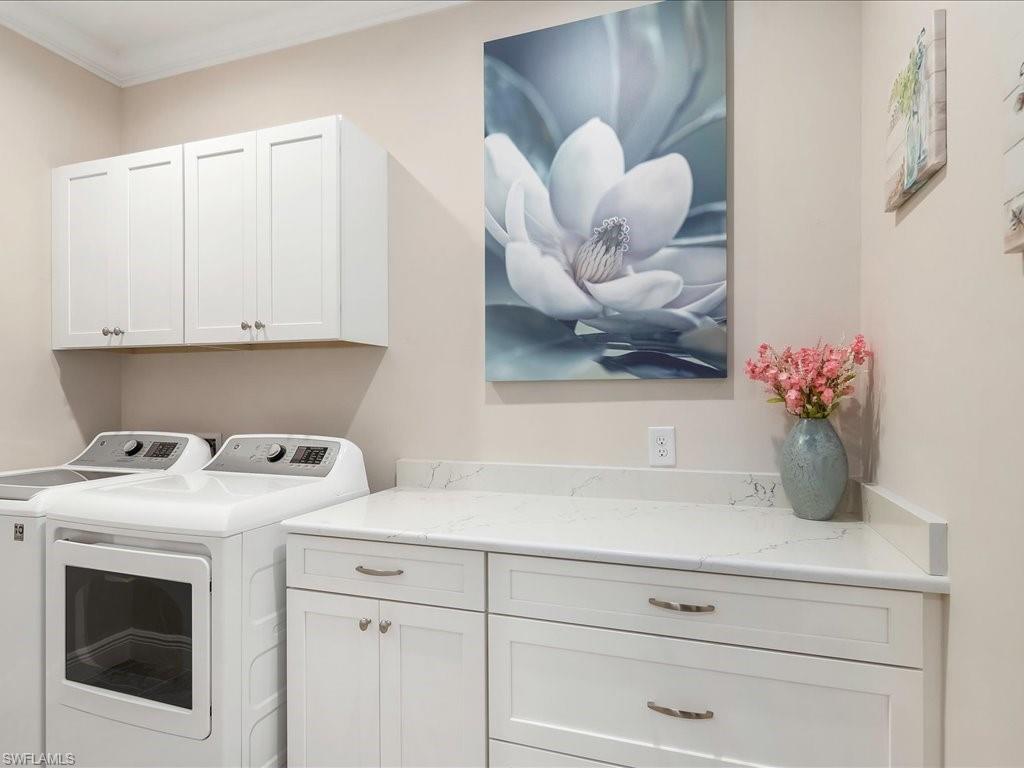 2227 Marquesa Circle Naples, FL 34112 - Photo 11 of 26 a kitchen with a sink cabinets and window