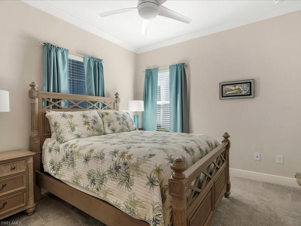 2227 Marquesa Circle Naples, FL 34112 - Photo 13 of 26 a bedroom with a bed and a window