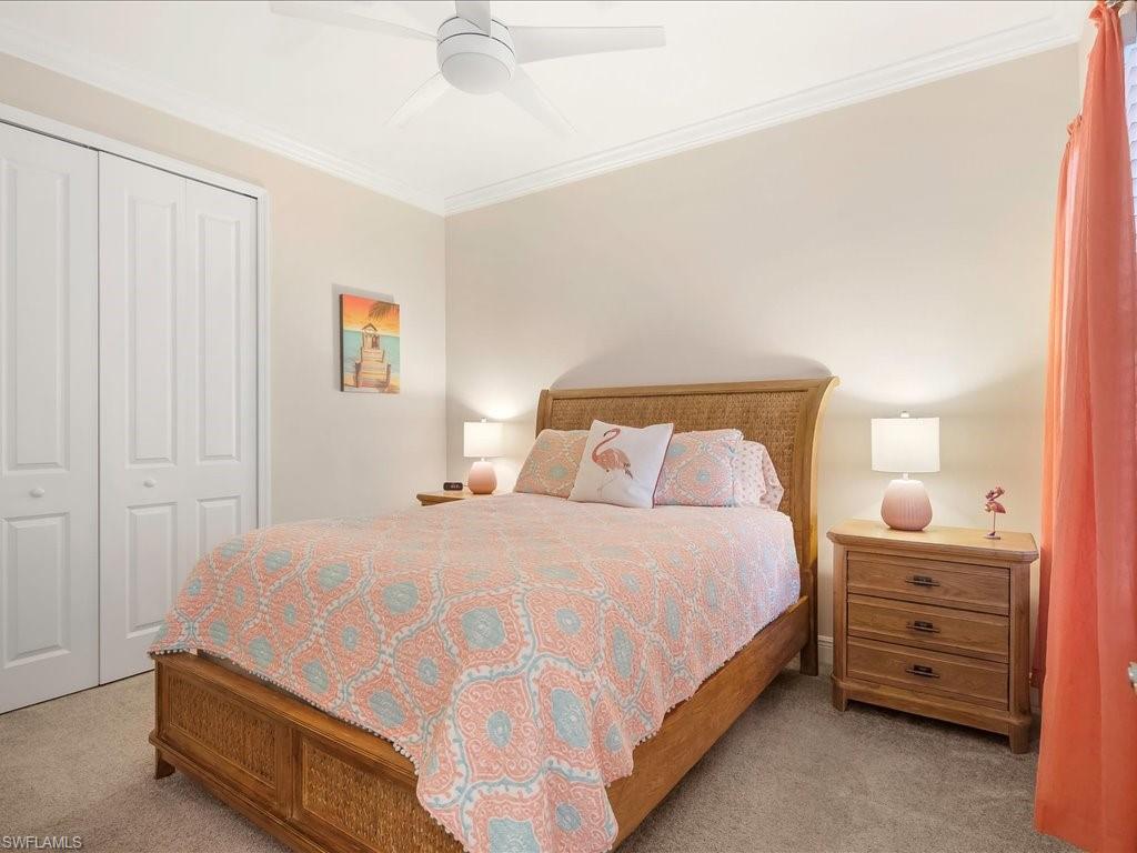 2227 Marquesa Circle Naples, FL 34112 - Photo 14 of 26 a bedroom with a bed and a window