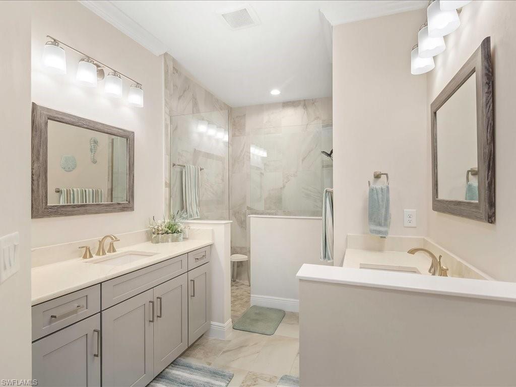 2227 Marquesa Circle Naples, FL 34112 - Photo 20 of 26 a bathroom with a double vanity sink mirror and double