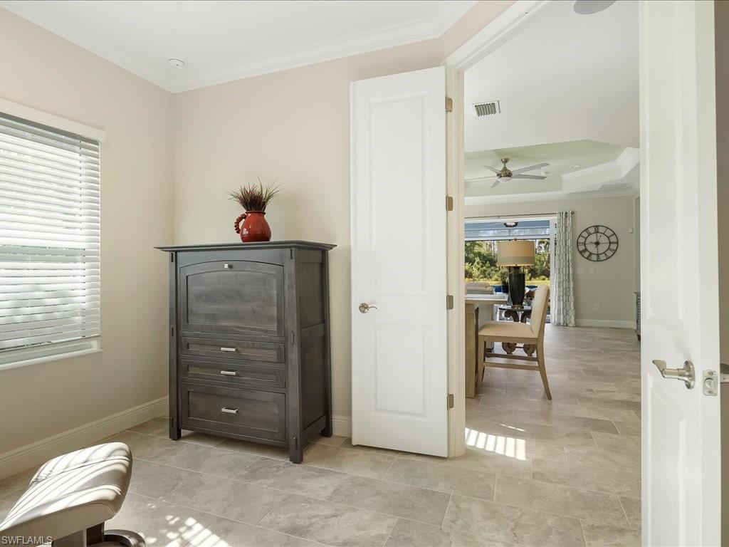 2227 Marquesa Circle Naples, FL 34112 - Photo 22 of 26 a living room with furniture
