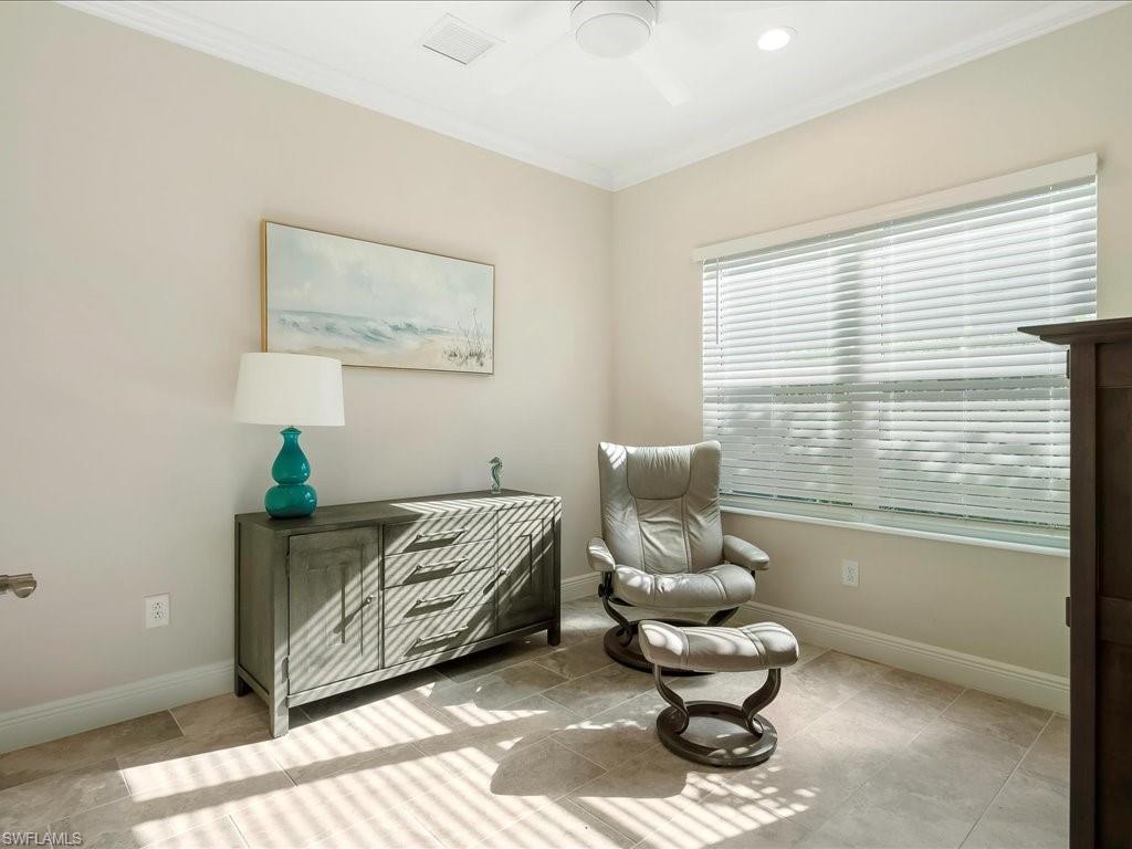 2227 Marquesa Circle Naples, FL 34112 - Photo 23 of 26 a living room with furniture and a large window