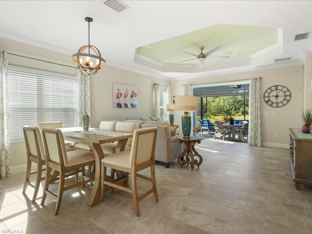 2227 Marquesa Circle Naples, FL 34112 - Photo 3 of 26 a view of a dining room with furniture window and outside view