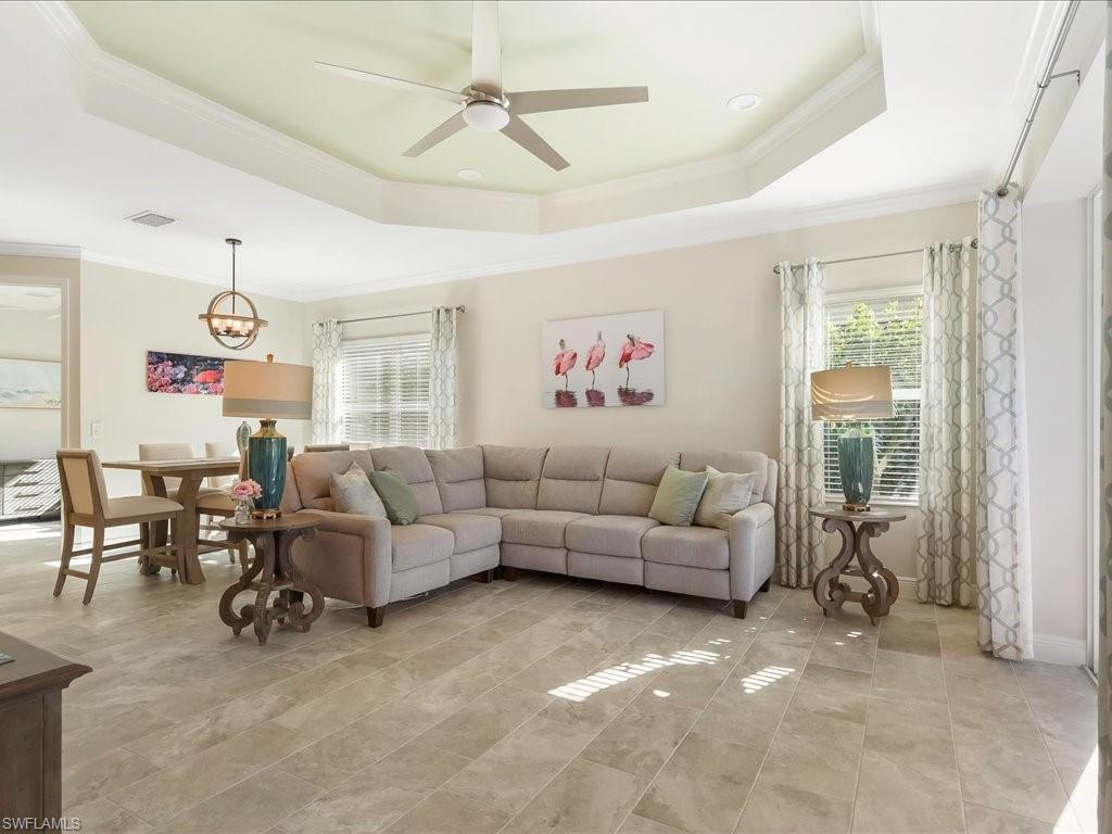 2227 Marquesa Circle Naples, FL 34112 - Photo 4 of 26 a living room with furniture and a large window