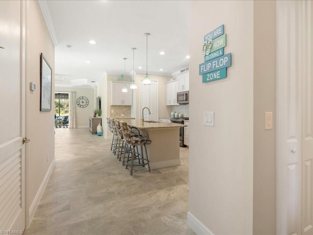 2227 Marquesa Circle Naples, FL 34112 - Photo 8 of 26 a view of kitchen with furniture and a refrigerator