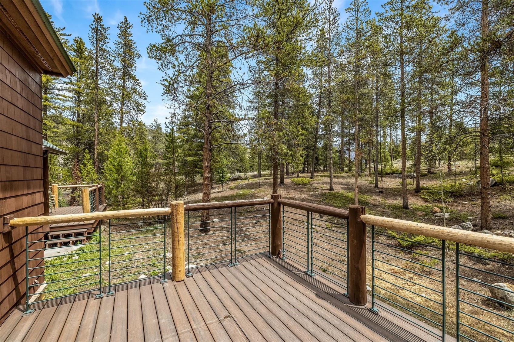 71 Starfire Lane, Unit 1978 Keystone, CO 80435 - Photo 8 of 40 a view of balcony with wooden floor and fence