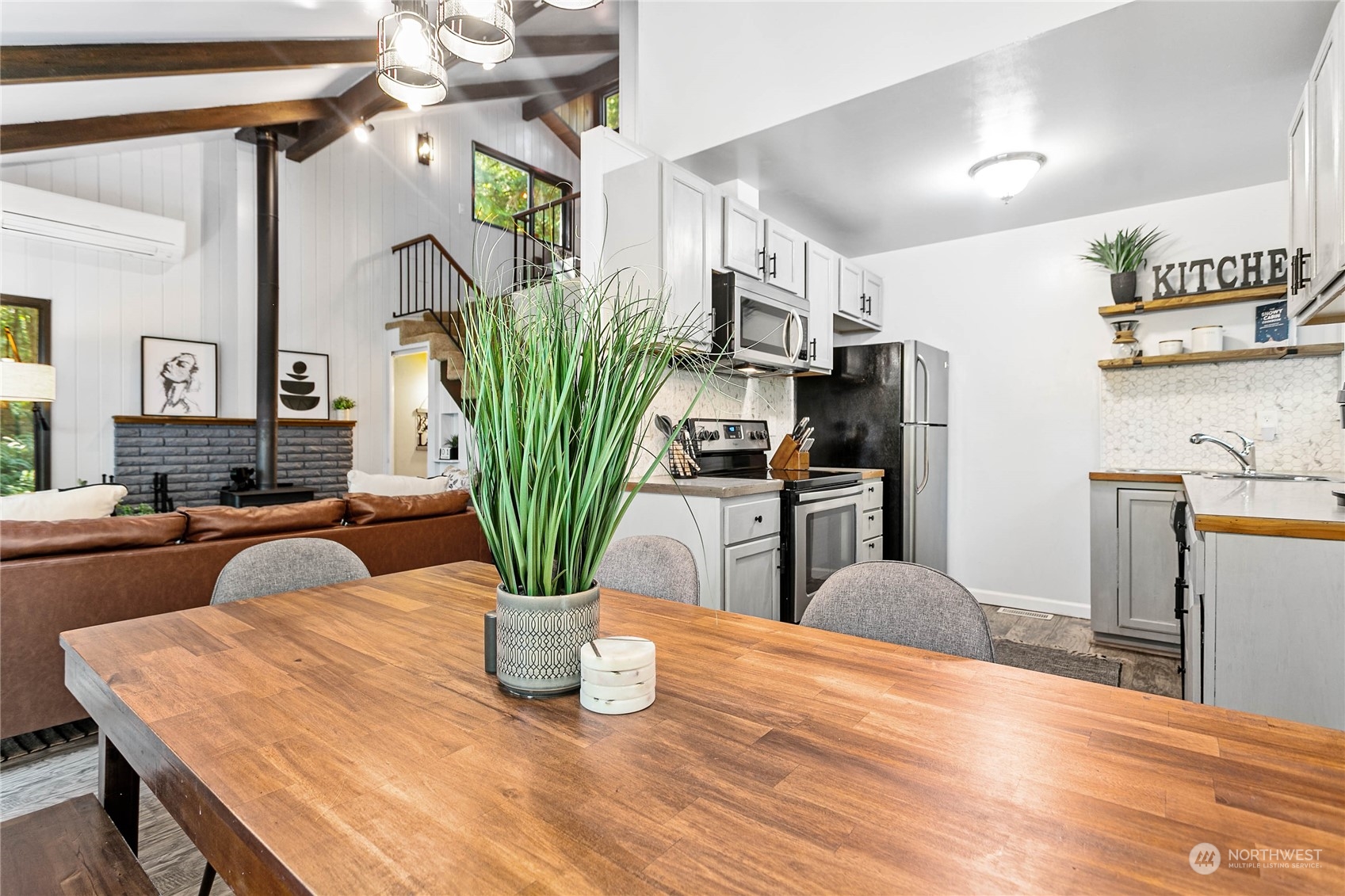 23 Hillside Place Bellingham, WA 98229 - Photo 13 of 39 a view of a dining room with furniture and a potted plant