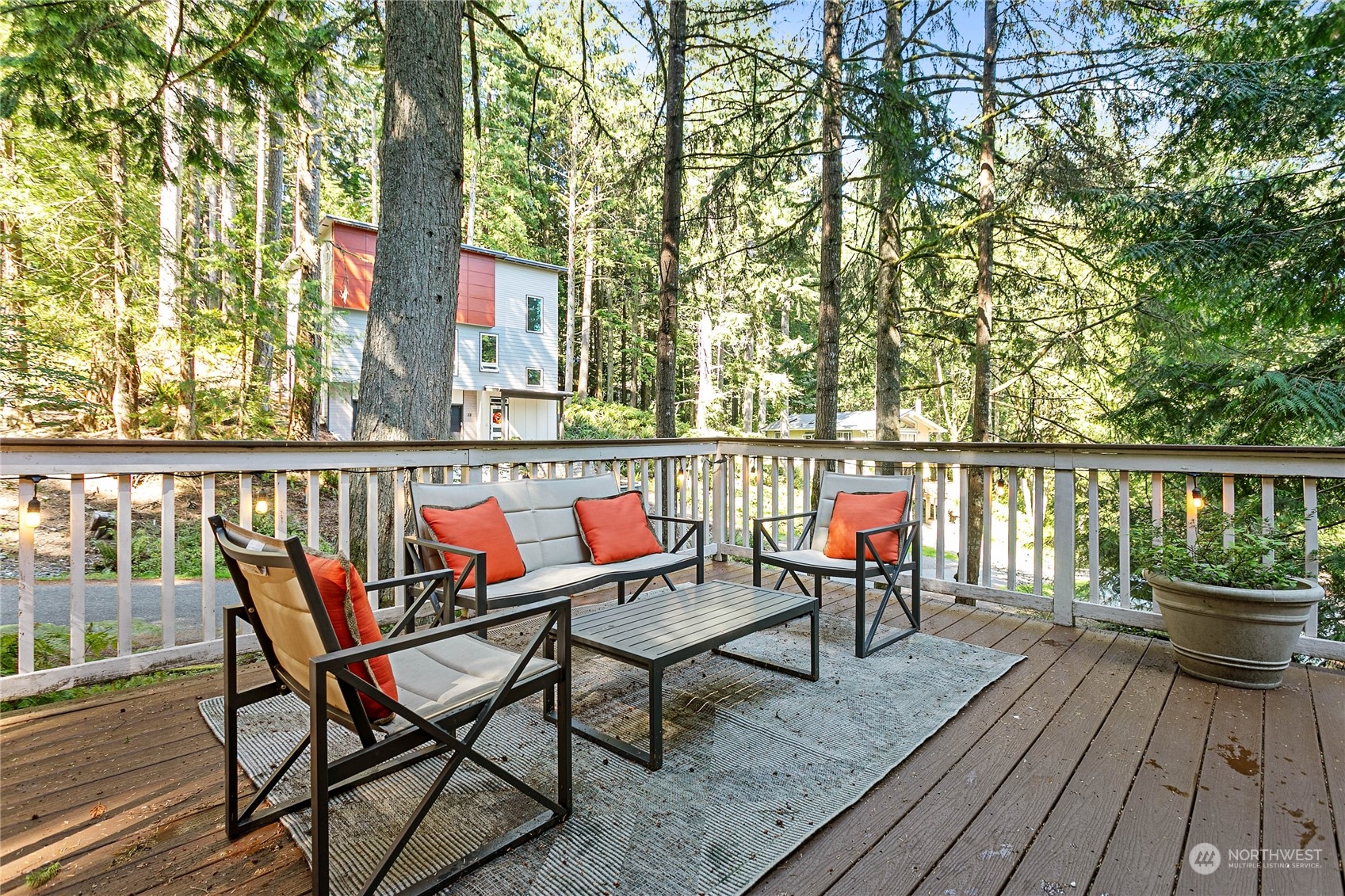 23 Hillside Place Bellingham, WA 98229 - Photo 31 of 39 a balcony with wooden floor outdoor seating and wooden floor