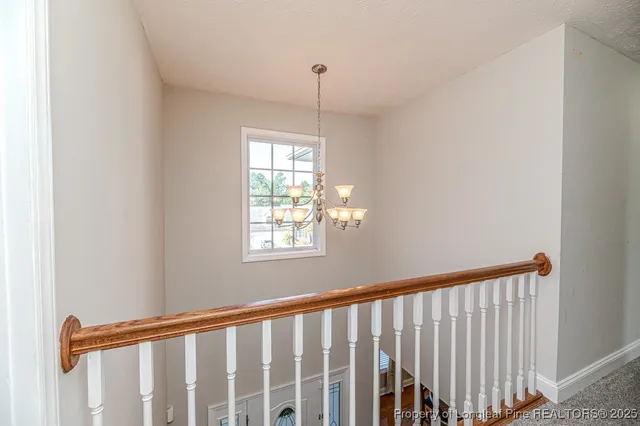 a view of a hallway with windows