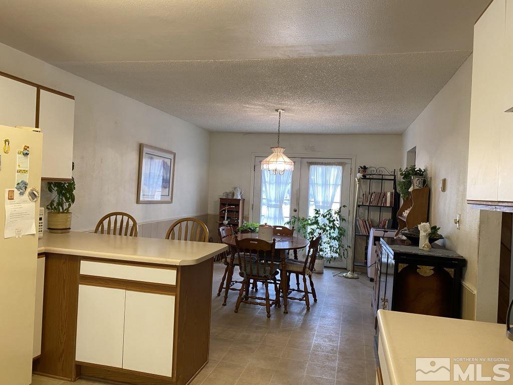 14700 Chamy Drive Reno, NV 89521 - Photo 4 of 23 a dining room with furniture and chandelier