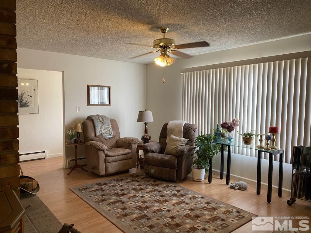 14700 Chamy Drive Reno, NV 89521 - Photo 6 of 23 a living room with furniture rug and wooden floor