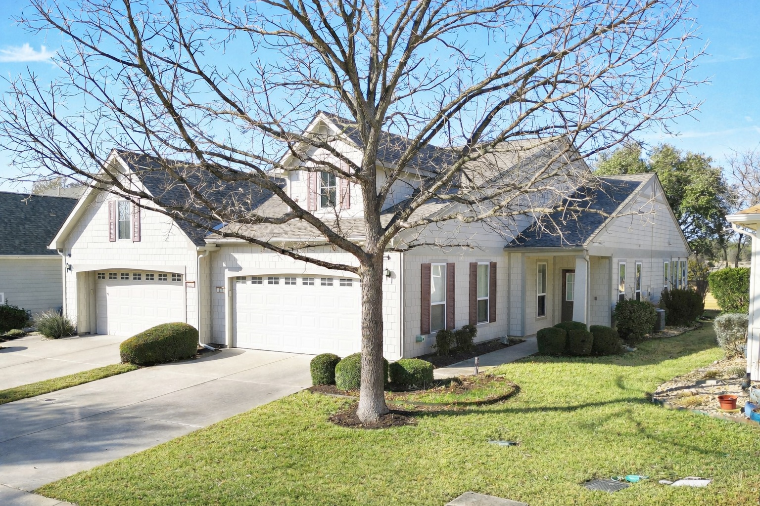a front view of a house with garden
