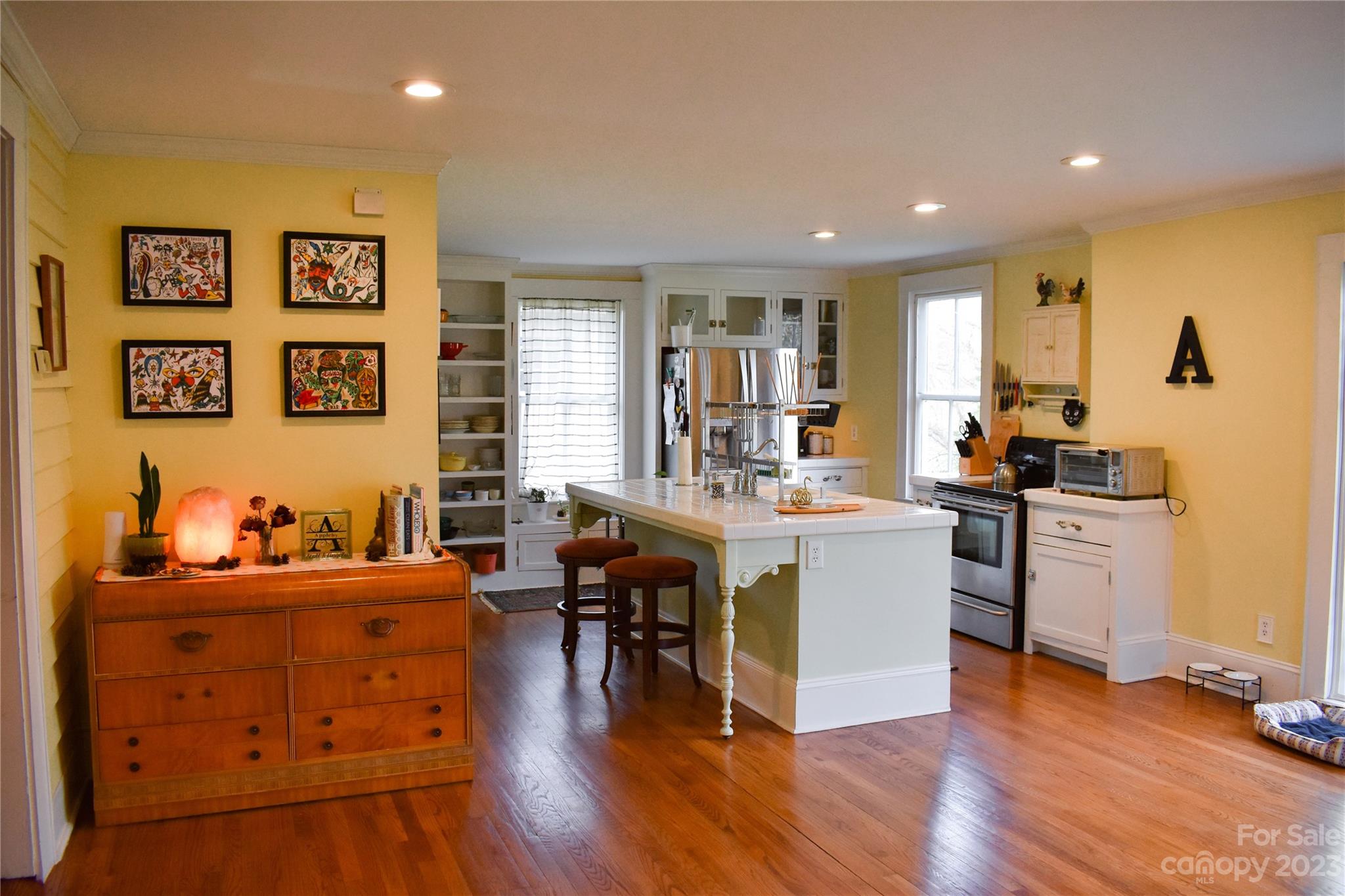 506 Main Street Southwest Lenoir, NC 28645 - Photo 19 of 29 a large living room with stainless steel appliances kitchen island granite countertop wooden floors and a large window