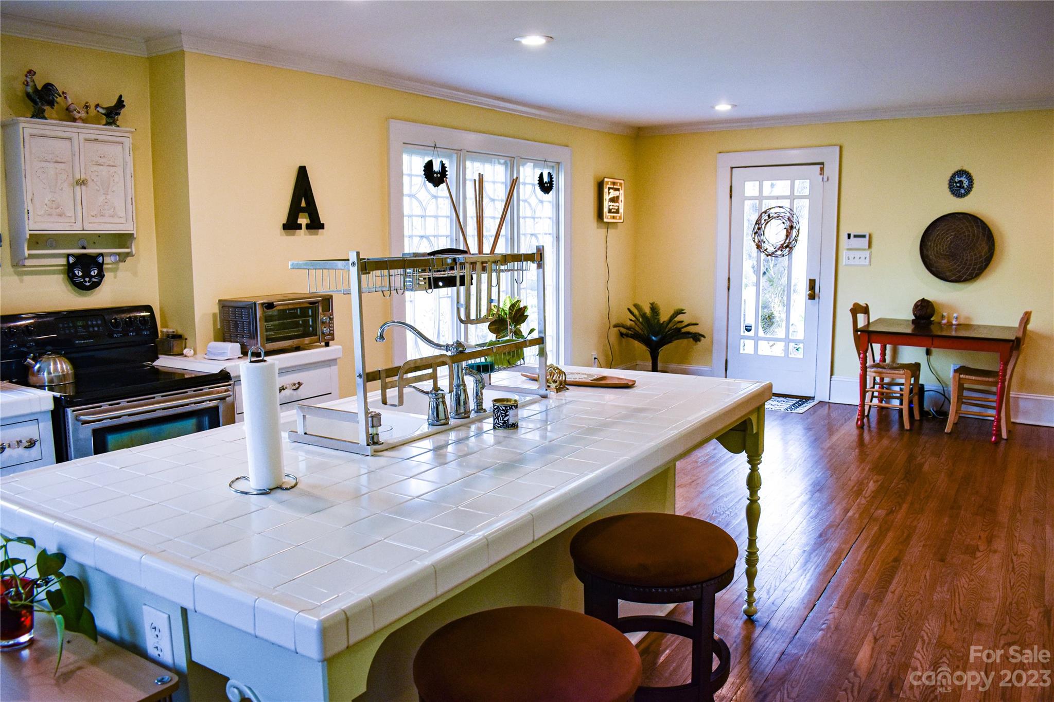 506 Main Street Southwest Lenoir, NC 28645 - Photo 21 of 29 a kitchen with a table chairs and wooden floor