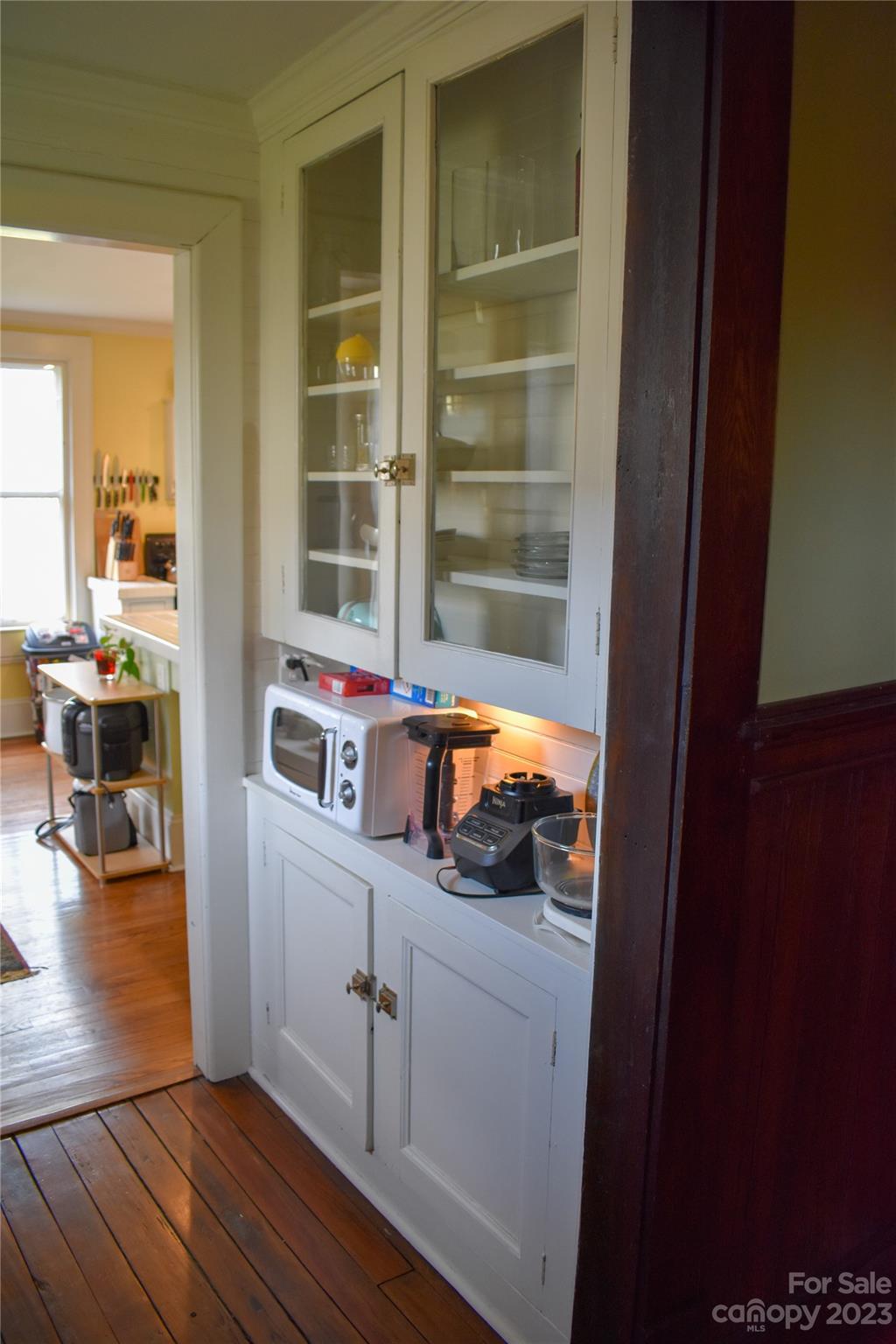 506 Main Street Southwest Lenoir, NC 28645 - Photo 22 of 29 a room with wooden floor and furniture