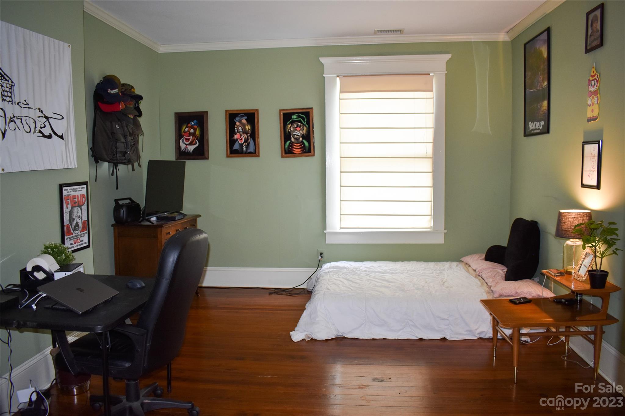 506 Main Street Southwest Lenoir, NC 28645 - Photo 27 of 29 a bedroom with a bed and wooden floor