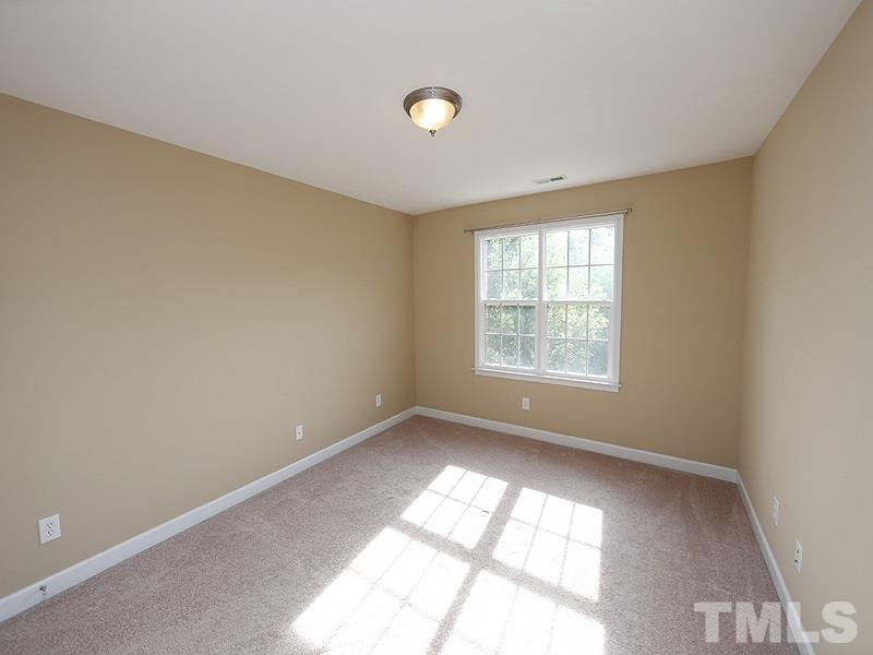 5947 Four Townes Lane Raleigh, NC 27616 - Photo 9 of 12 an empty room with a window