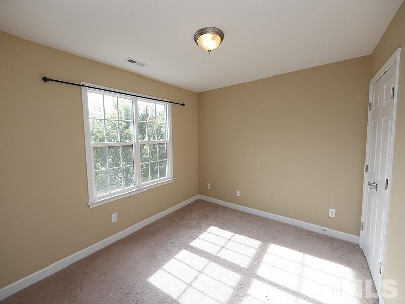 5947 Four Townes Lane Raleigh, NC 27616 - Photo 10 of 12 a view of an empty room with a window