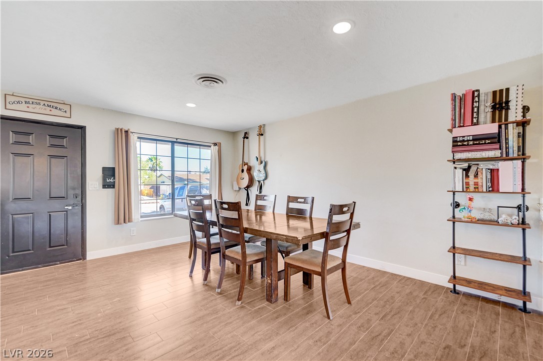 1331 Pinto Road Boulder City, NV 89005 - Photo 16 of 46 Recessed lighting illuminates the dining area with warm, inviting tones.